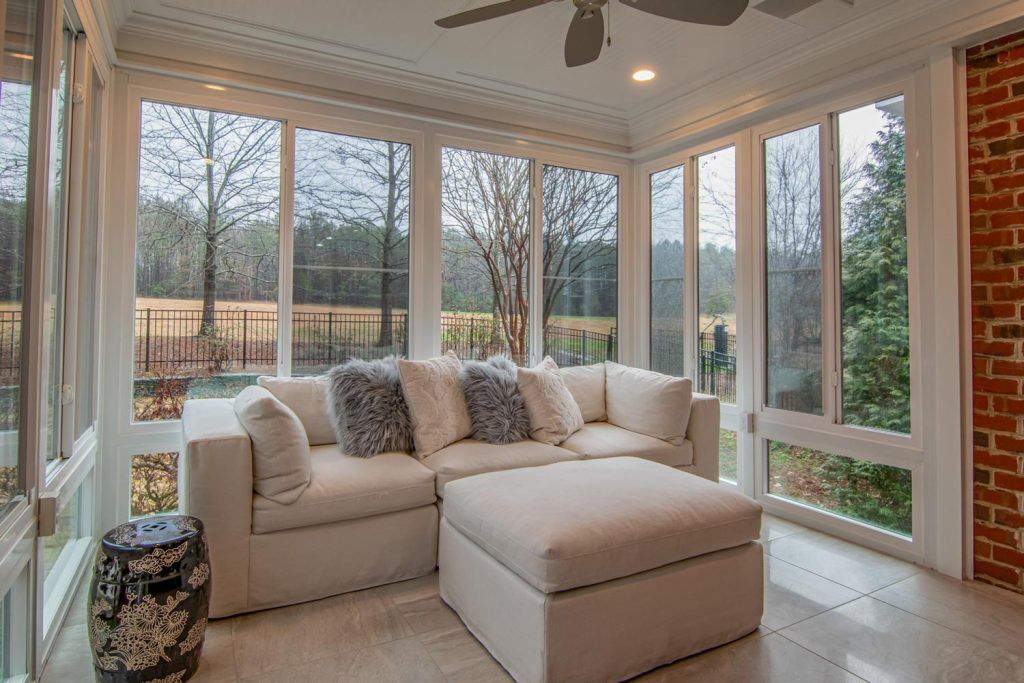 A room with sofa and windows