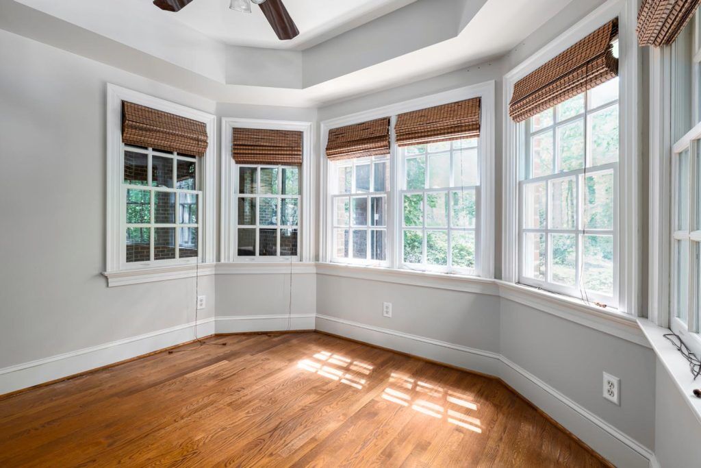 An empty room with multiple window