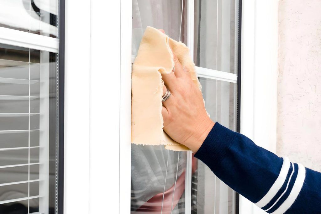 Cleaning the window with a small piece of cloth