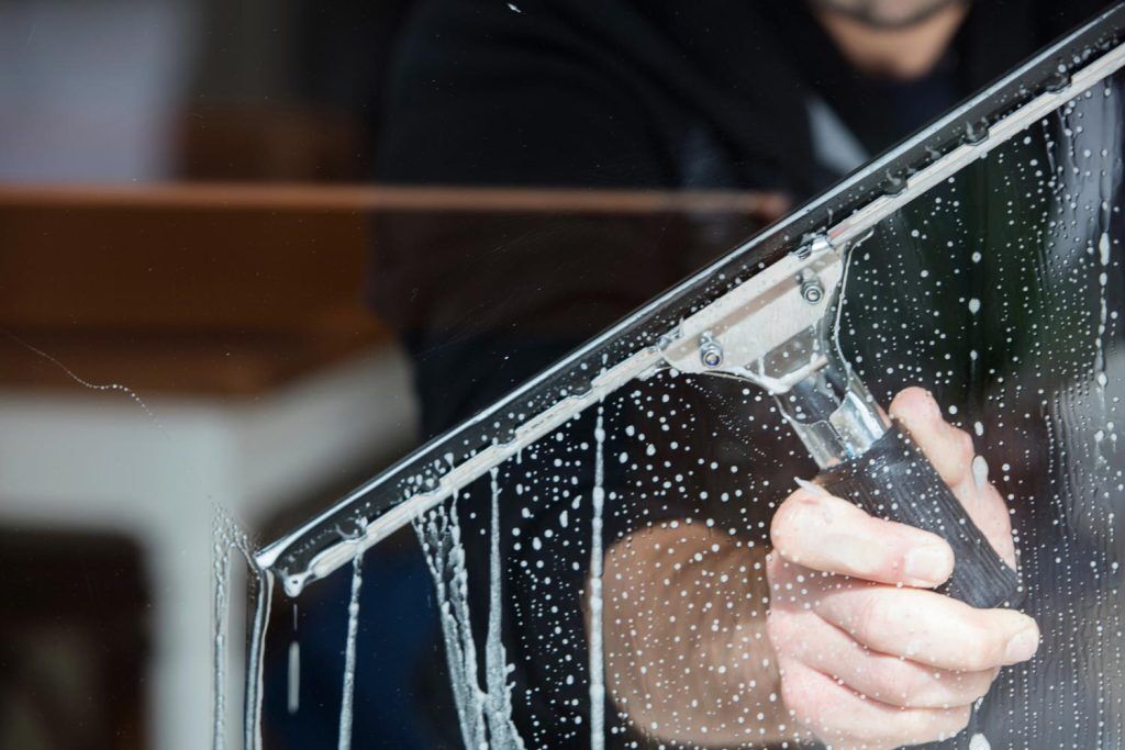 Man cleaning the window