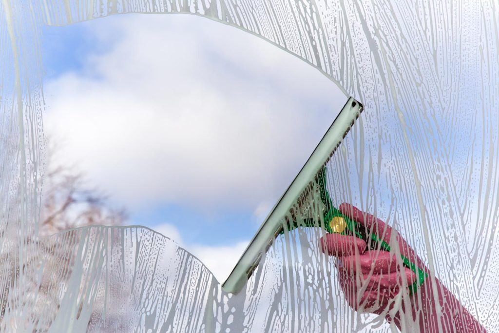 Woman cleaning a window